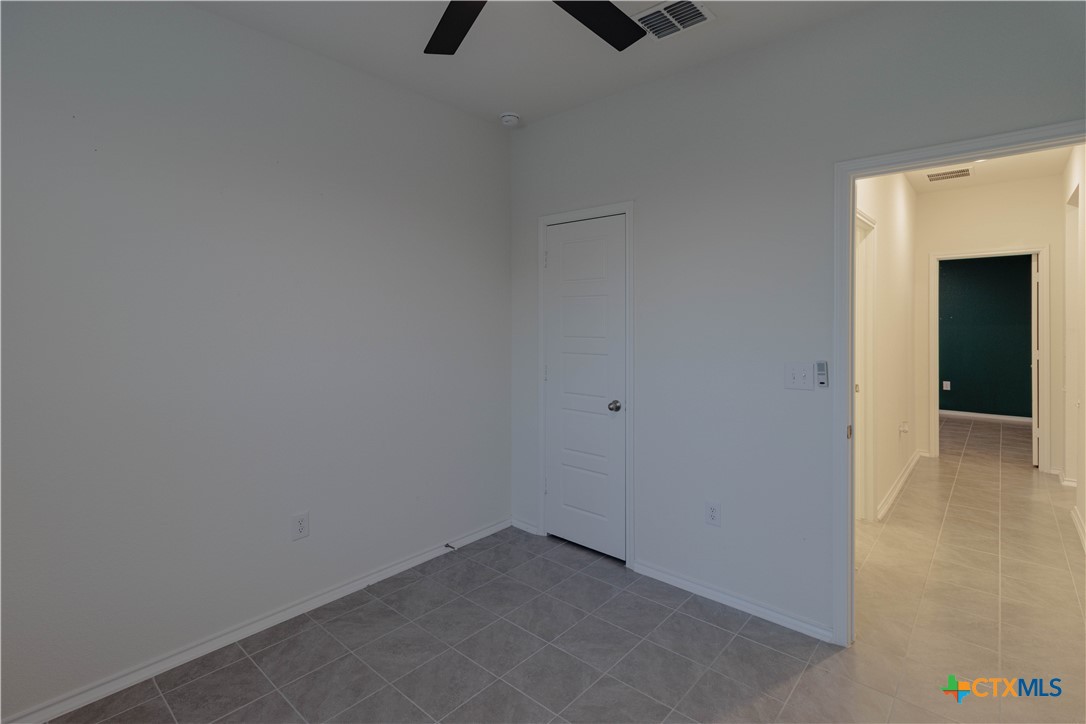 211 Summit Drive Lockhart, TX 78644 - Photo 11 of 33 a view of an empty room with closet and window