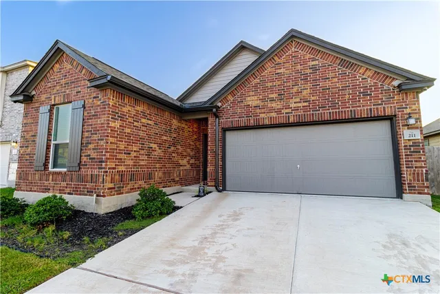 a view of backyard of a house