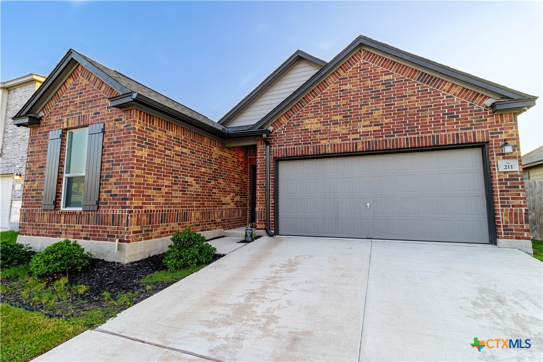211 Summit Drive Lockhart, TX 78644 - Photo 3 of 33 a view of backyard of a house