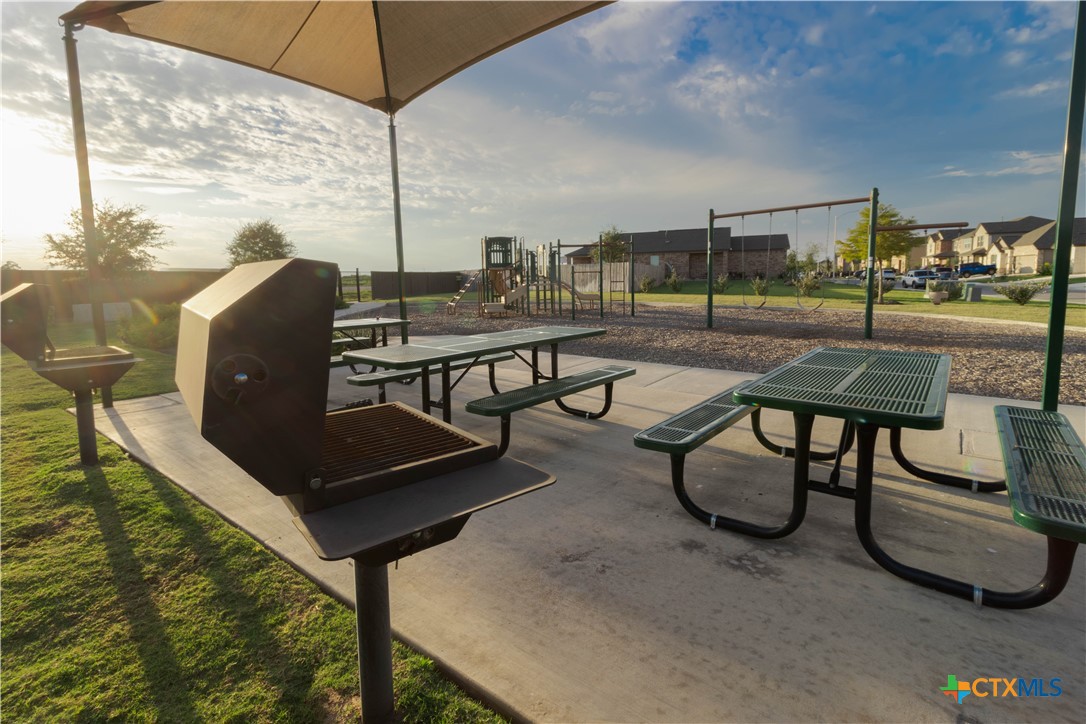 211 Summit Drive Lockhart, TX 78644 - Photo 32 of 33 a view of a chairs and table in the patio