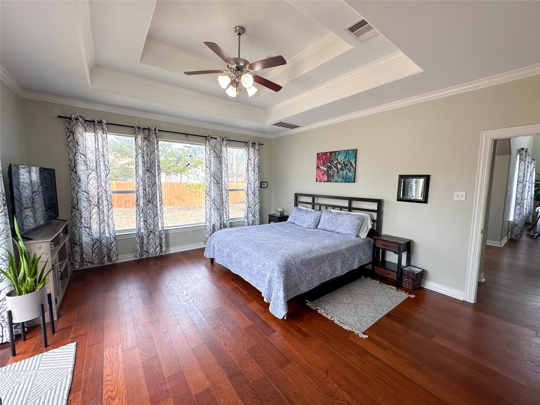 237 Cardinal Drive Paige, TX 78659 - Photo 11 of 37 Bedroom with dark wood-style flooring, ornamental molding, and ceiling fan