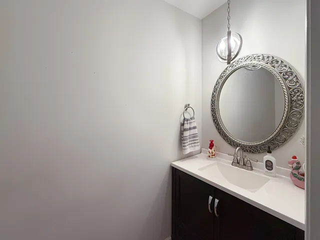 a white toilet sitting next to a bathroom sink