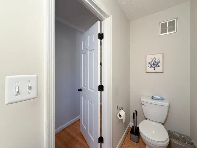 a view of a hallway with wooden shelves