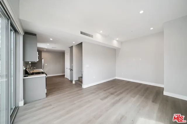 a view of kitchen with wooden floor