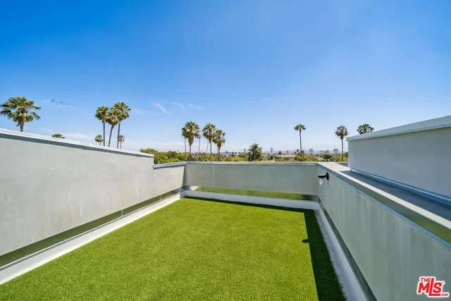 a view of a swimming pool and an outdoor space