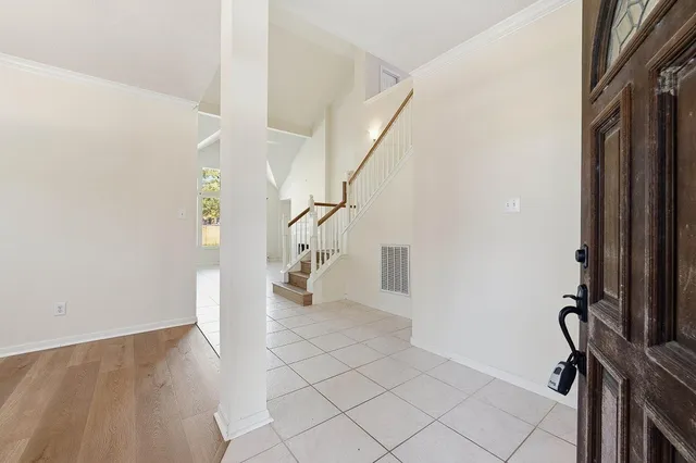 a view of an entryway with wooden floor