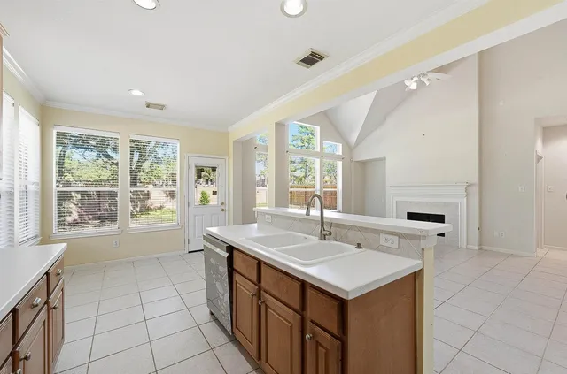 a bathroom with a sink a large mirror and a bathtub
