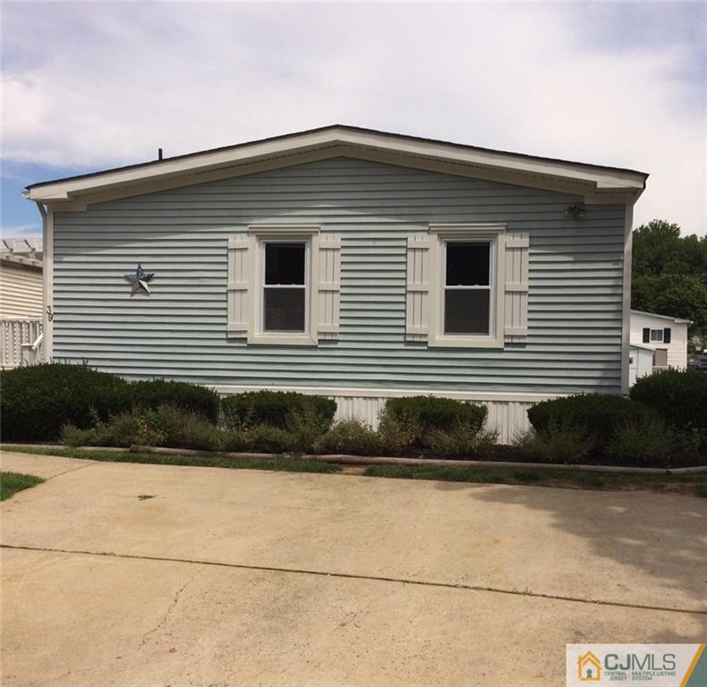 39 Poe Road, Unit 39 North Brunswick, NJ 08902 - Photo 1 of 21 a front view of a house