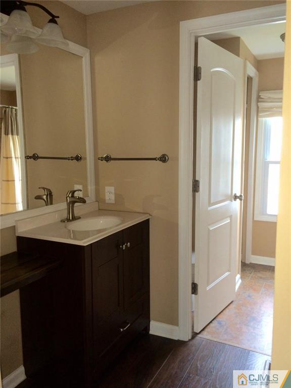 39 Poe Road, Unit 39 North Brunswick, NJ 08902 - Photo 12 of 21 a bathroom with a sink and a mirror