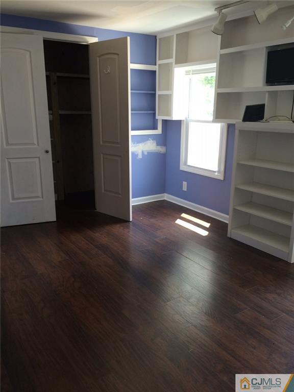 39 Poe Road, Unit 39 North Brunswick, NJ 08902 - Photo 17 of 21 an empty room with windows and closet