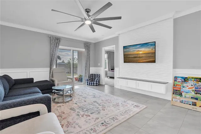 a living room with furniture and a rug