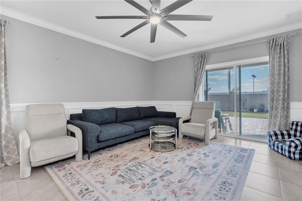 31130 Penny Surf Loop Wesley Chapel, FL 33545 - Photo 12 of 42 a living room with furniture and a rug