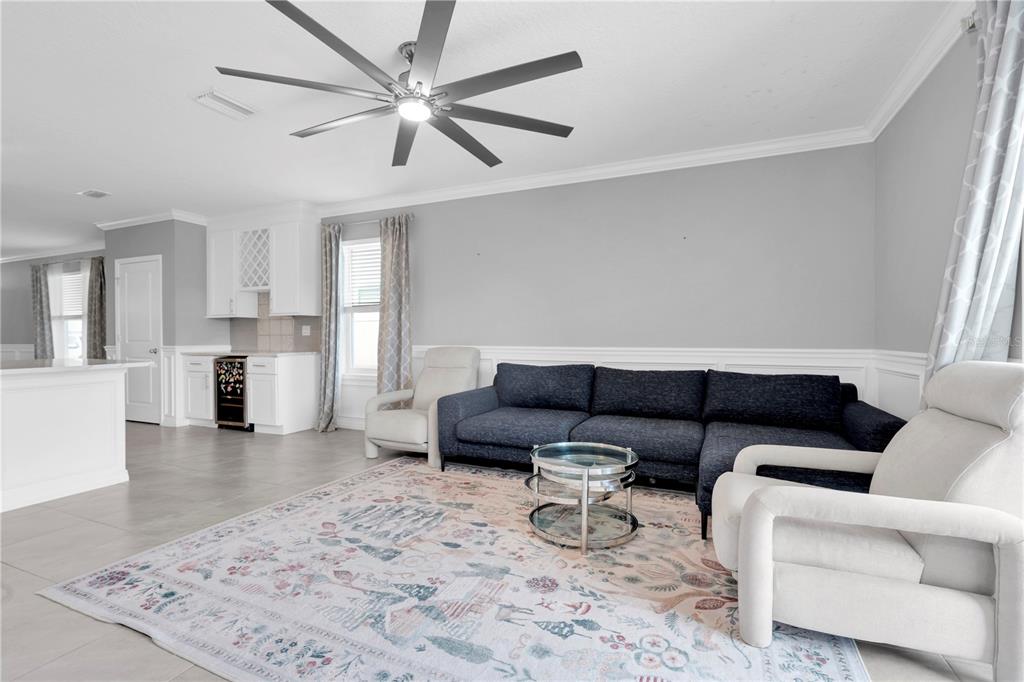 31130 Penny Surf Loop Wesley Chapel, FL 33545 - Photo 13 of 42 a living room with furniture and kitchen view