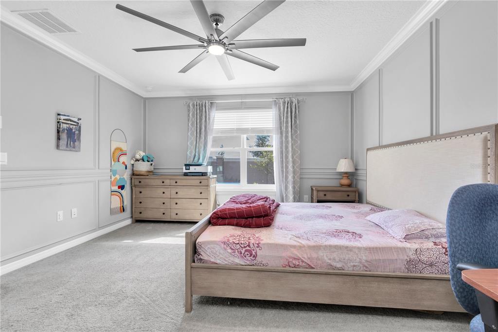 31130 Penny Surf Loop Wesley Chapel, FL 33545 - Photo 16 of 42 a bedroom with a bed mirror and window