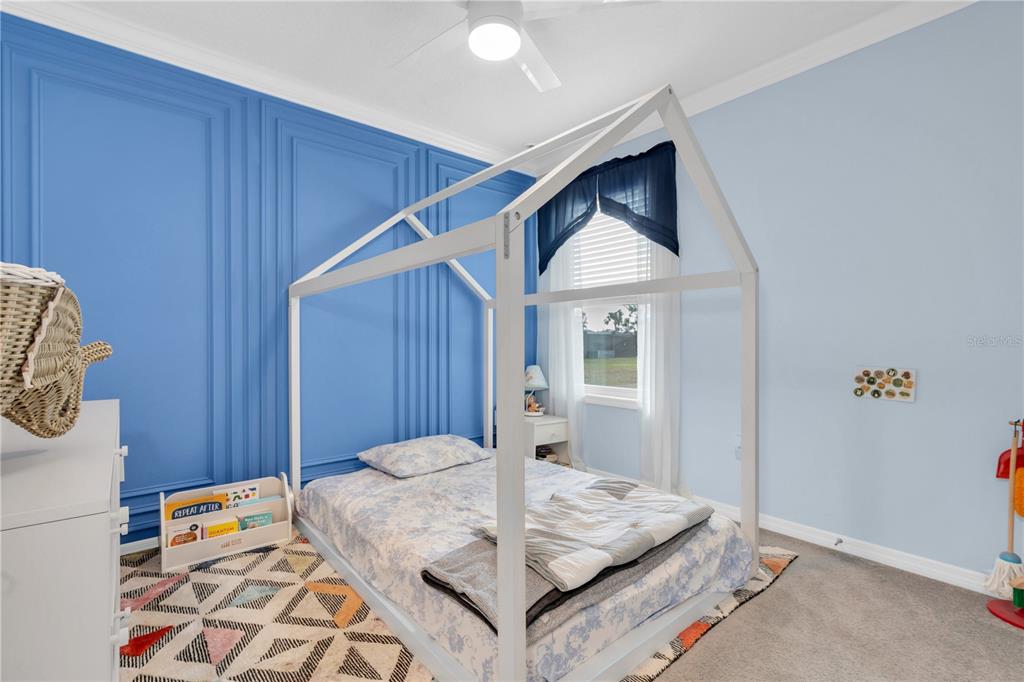31130 Penny Surf Loop Wesley Chapel, FL 33545 - Photo 19 of 42 a view of kitchen island with furniture and wooden floor