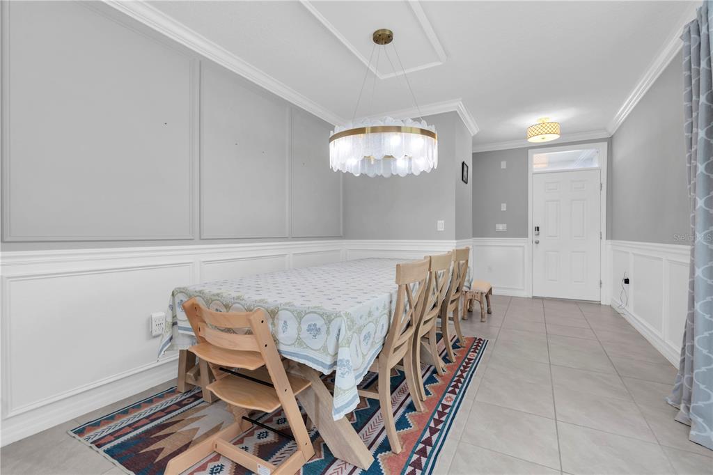 31130 Penny Surf Loop Wesley Chapel, FL 33545 - Photo 2 of 42 a view of an empty room with wooden floor