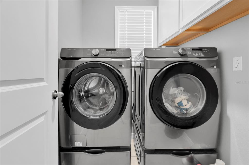 31130 Penny Surf Loop Wesley Chapel, FL 33545 - Photo 24 of 42 a utility room with dryer and washer