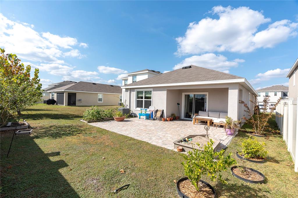 31130 Penny Surf Loop Wesley Chapel, FL 33545 - Photo 26 of 42 a view of a house with backyard and sitting area