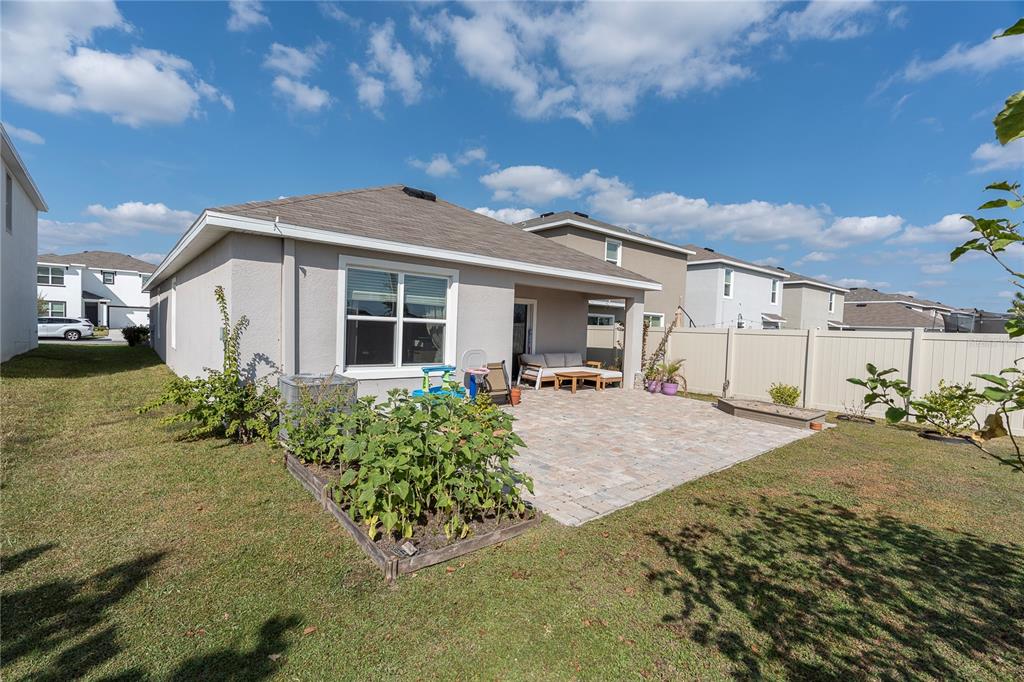 31130 Penny Surf Loop Wesley Chapel, FL 33545 - Photo 27 of 42 a front view of a house with a yard