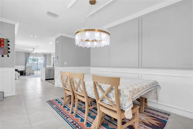 a view of a livingroom with furniture and chandelier