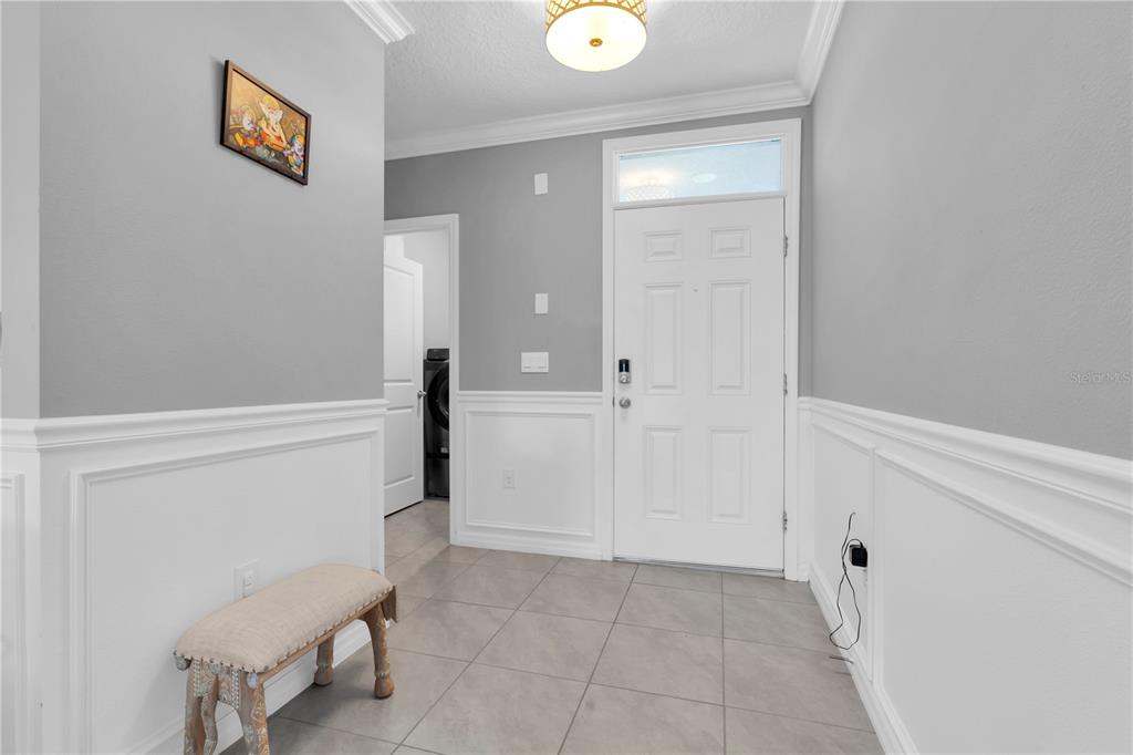 31130 Penny Surf Loop Wesley Chapel, FL 33545 - Photo 4 of 42 a view of a hallway with entryway