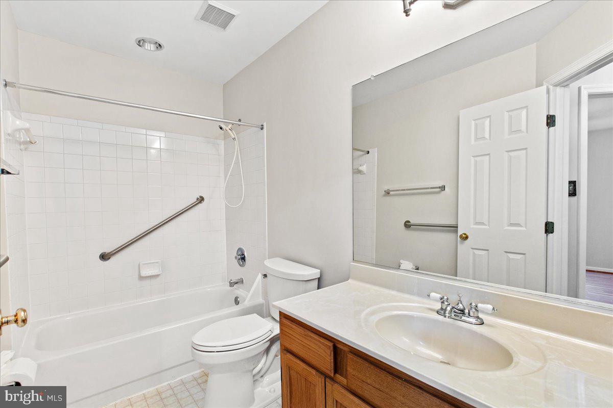 8307 Southstream Run Springfield, VA 22153 - Photo 14 of 49 a bathroom with a sink a toilet and a bathtub