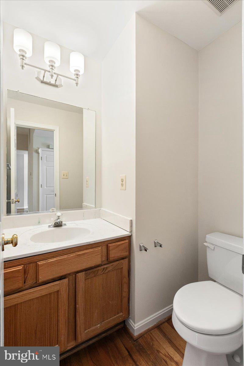 8307 Southstream Run Springfield, VA 22153 - Photo 16 of 49 a bathroom with a sink a toilet and a mirror