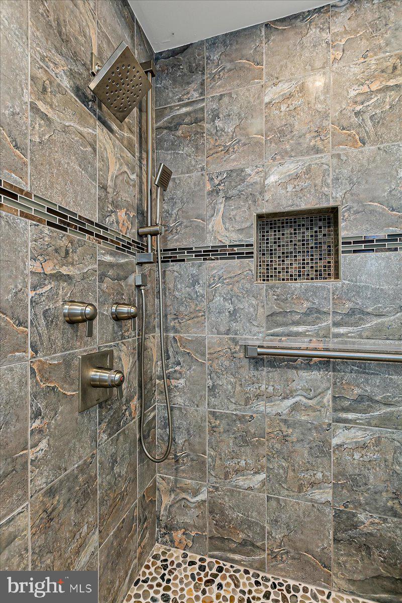 8307 Southstream Run Springfield, VA 22153 - Photo 38 of 49 a bathroom with a shower