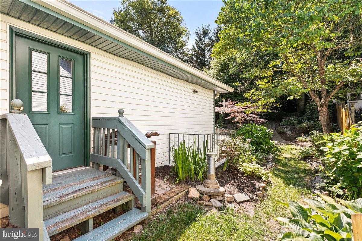 8307 Southstream Run Springfield, VA 22153 - Photo 44 of 49 a view of a house with backyard and deck