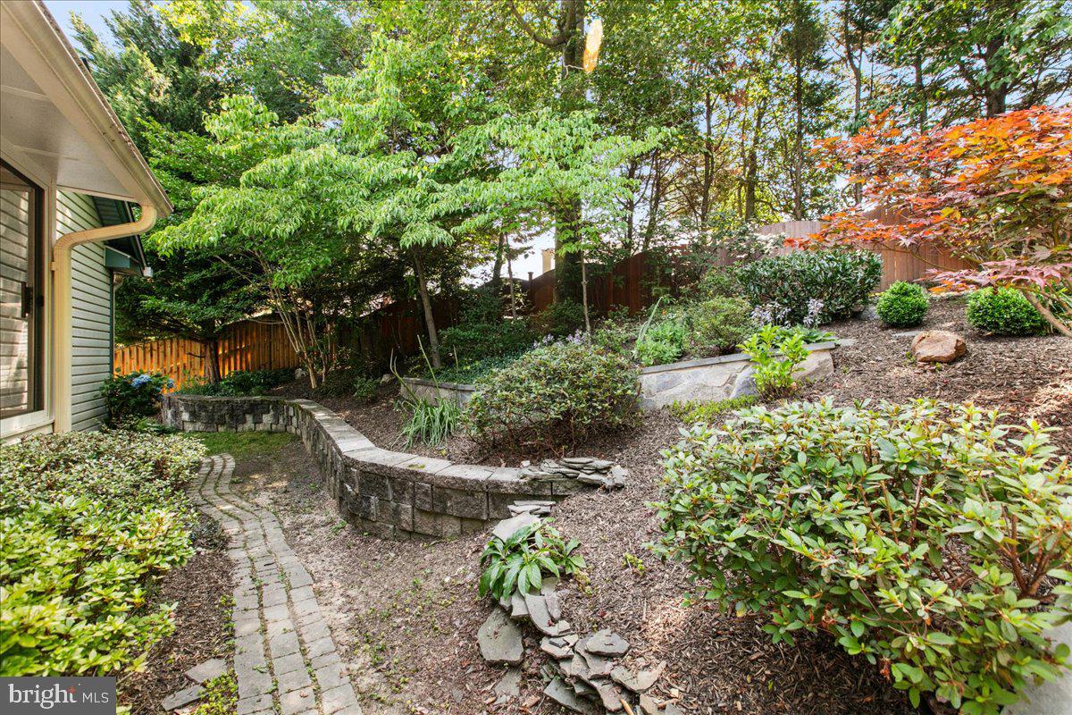 8307 Southstream Run Springfield, VA 22153 - Photo 48 of 49 a garden view with a seating space