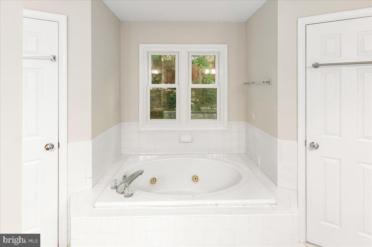 8307 Southstream Run Springfield, VA 22153 - Photo 6 of 49 a white bath tub sitting next to a window