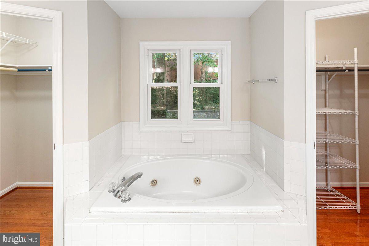 8307 Southstream Run Springfield, VA 22153 - Photo 7 of 49 a white bath tub sitting next to a window