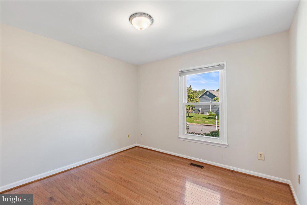 8307 Southstream Run Springfield, VA 22153 - Photo 10 of 49 an empty room with windows