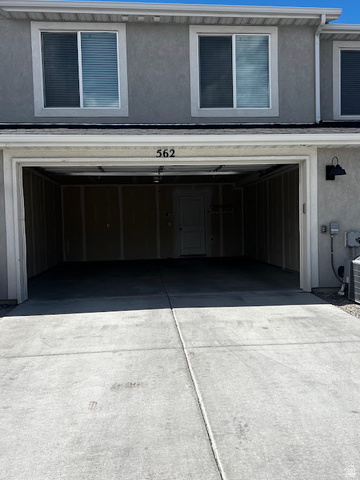 562 Hal Street, Unit 152 Tooele, UT 84074 - Photo 7 of 44 Spacious two-car garage with a concrete driveway