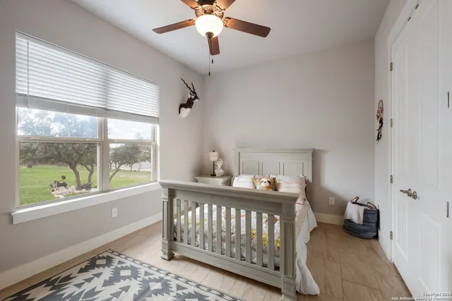a bedroom with furniture and a window