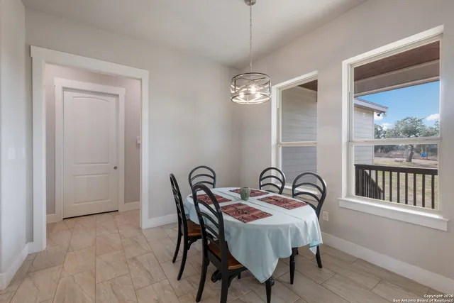 a bedroom with a bed and a table