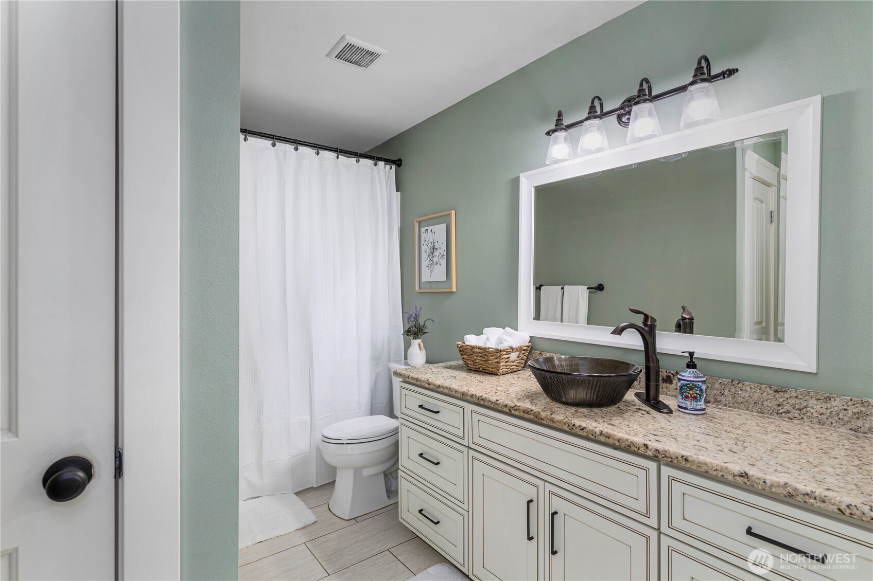 31 East Cove View Drive Belfair, WA 98528 - Photo 15 of 23 a bathroom with a granite countertop sink a toilet and mirror