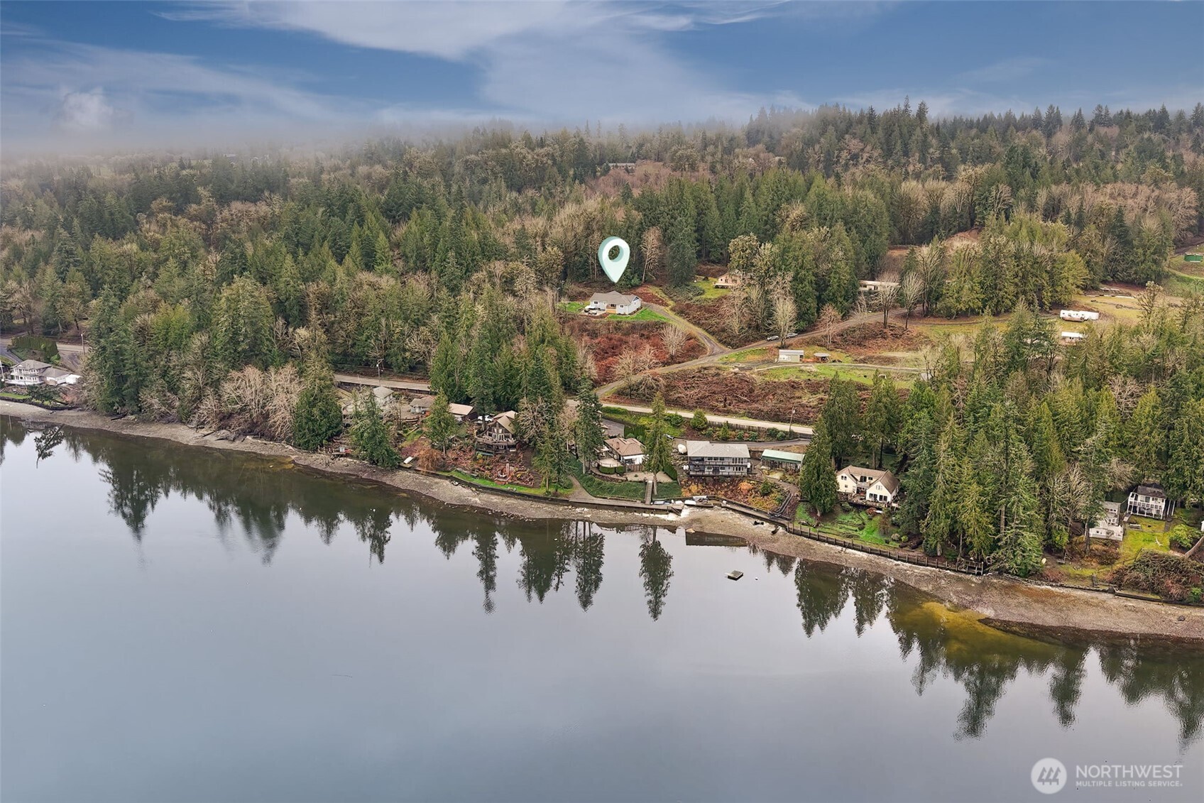 31 East Cove View Drive Belfair, WA 98528 - Photo 22 of 23 a view of a lake in middle of forest