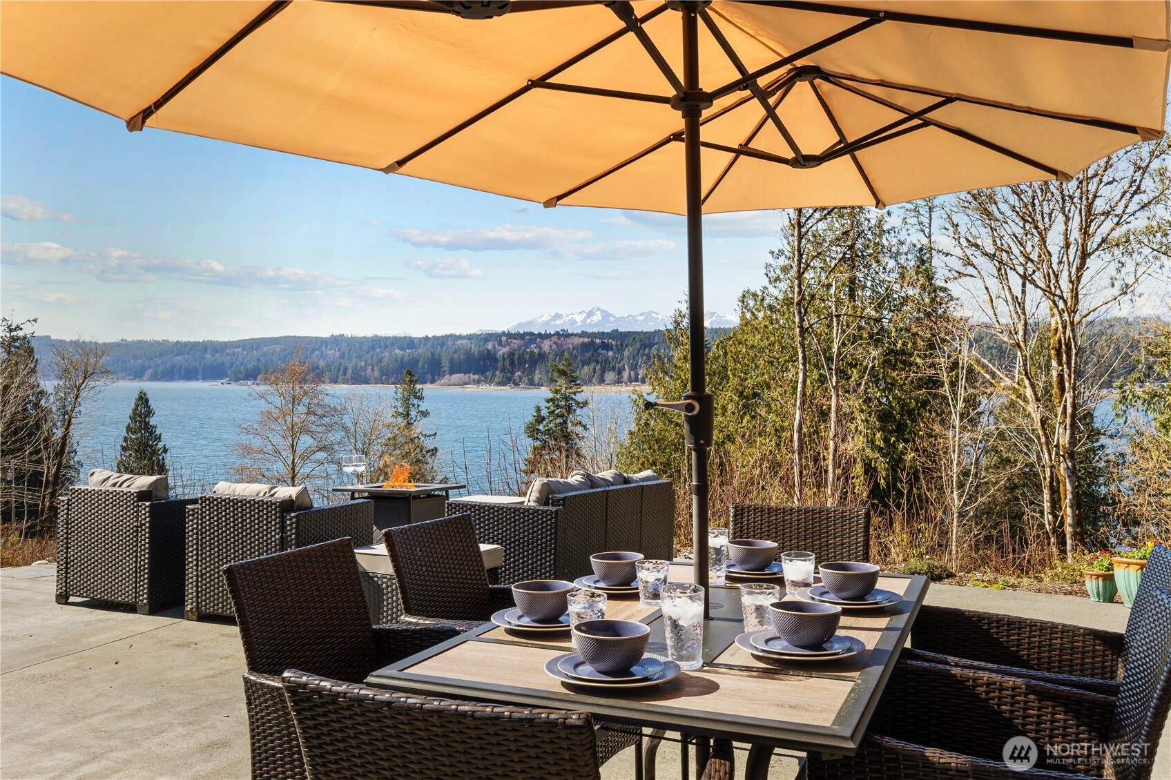 31 East Cove View Drive Belfair, WA 98528 - Photo 5 of 23 a view of a terrace with furniture and a potted plant