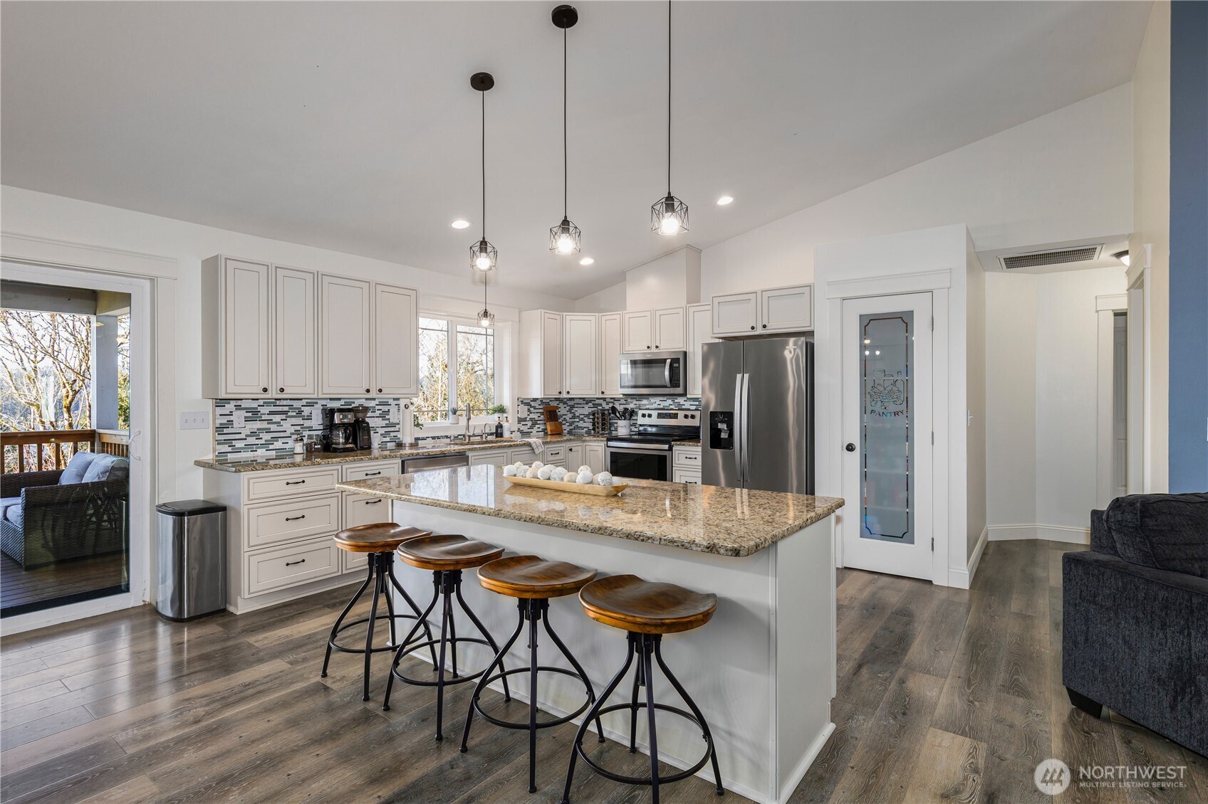 31 East Cove View Drive Belfair, WA 98528 - Photo 7 of 23 a large kitchen with kitchen island a large island in it
