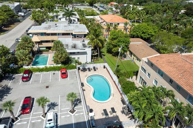 an aerial view of a house with outdoor space