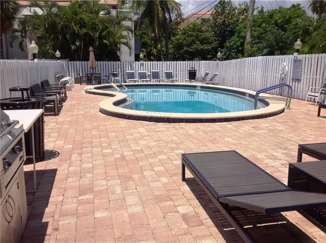 a view of a swimming pool with a patio