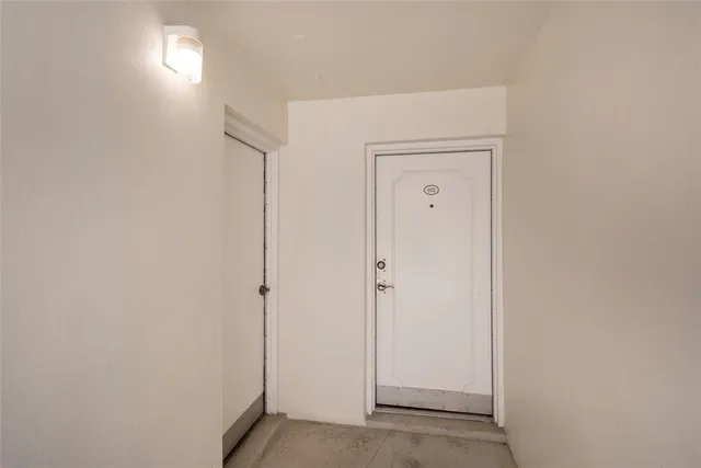 a view of a hallway with closet area