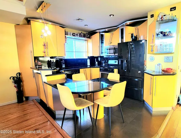 a picture of a living room with furniture and a rug