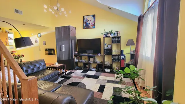 a bedroom with furniture and a wooden floor