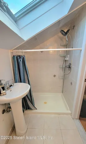 a room with furniture pool table table tennis a flat screen tv and a rug