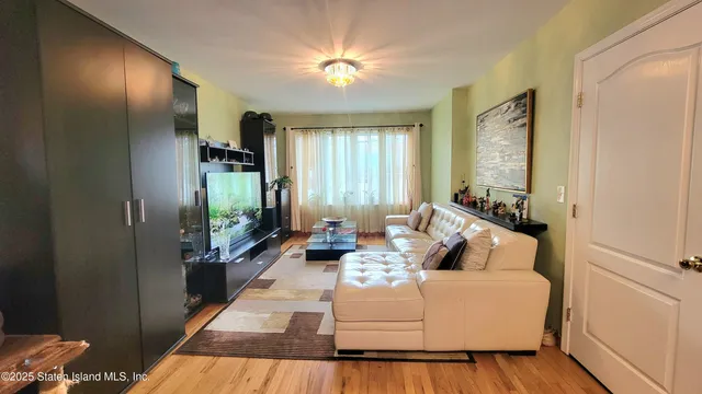 a bathroom with a toilet a sink and a mirror