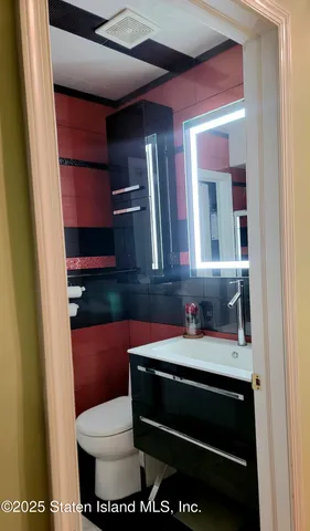 a view of a balcony with furniture and a floor to ceiling window