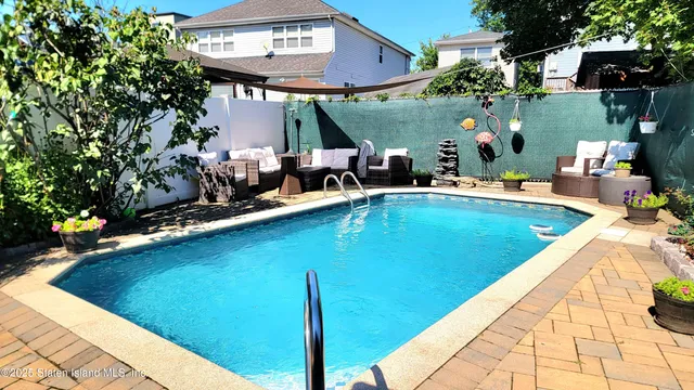 a view of a swimming pool with a patio