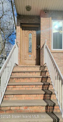 a living room with fireplace furniture and a flat screen tv